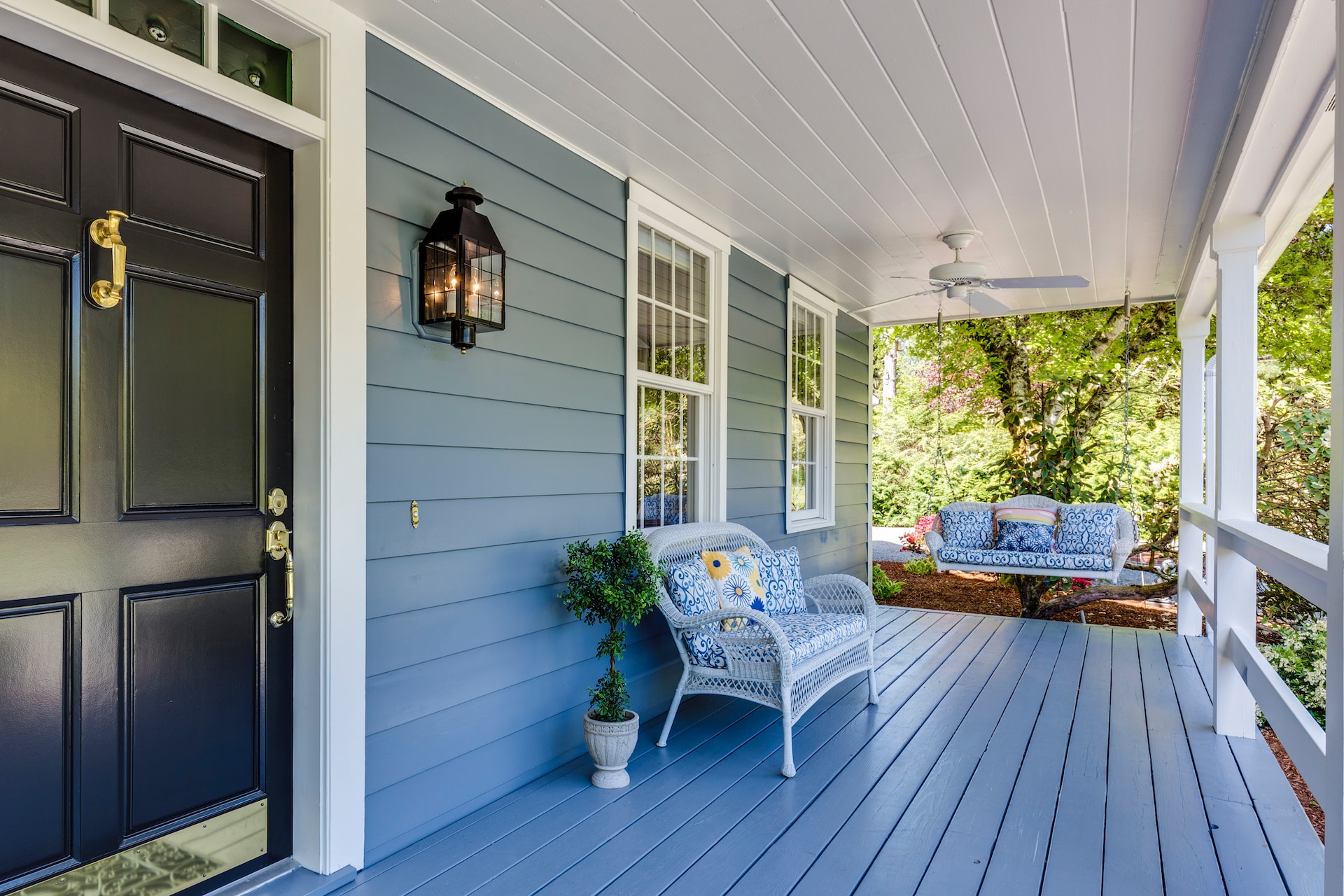 photo of cozy front porch swing representing the sale of multi-generational homes