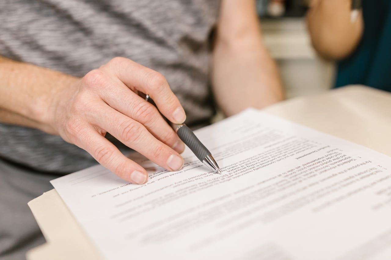 person reading lease document representing a residential landlord's responsibilities